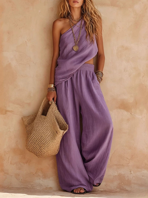 Women's one-shoulder wide-leg jumpsuit, elegant & flowing, with chic draped detailing for party wear.