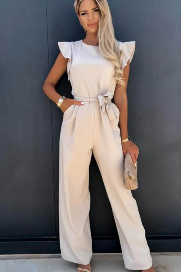 Black comfortable open-back women's jumpsuit. Casual chic style, flattering for spring fashion.