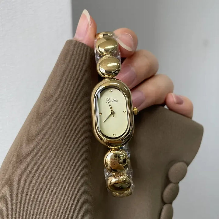 Elegant women's oval minimalist watch in stainless steel, a classic fashion timepiece.