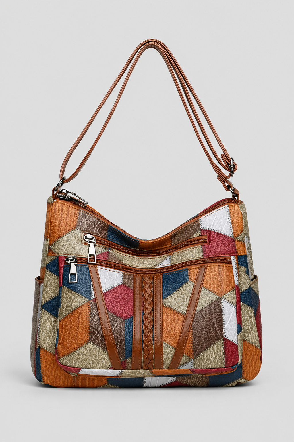 Elegant women's patchwork shoulder bag with artistic design. Unique fashion handbag for versatile everyday style.