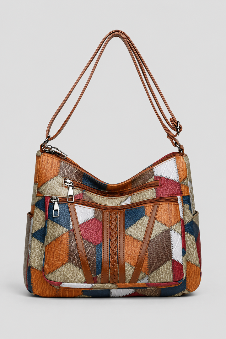 Elegant women's patchwork shoulder bag with artistic design. Unique fashion handbag for versatile everyday style.