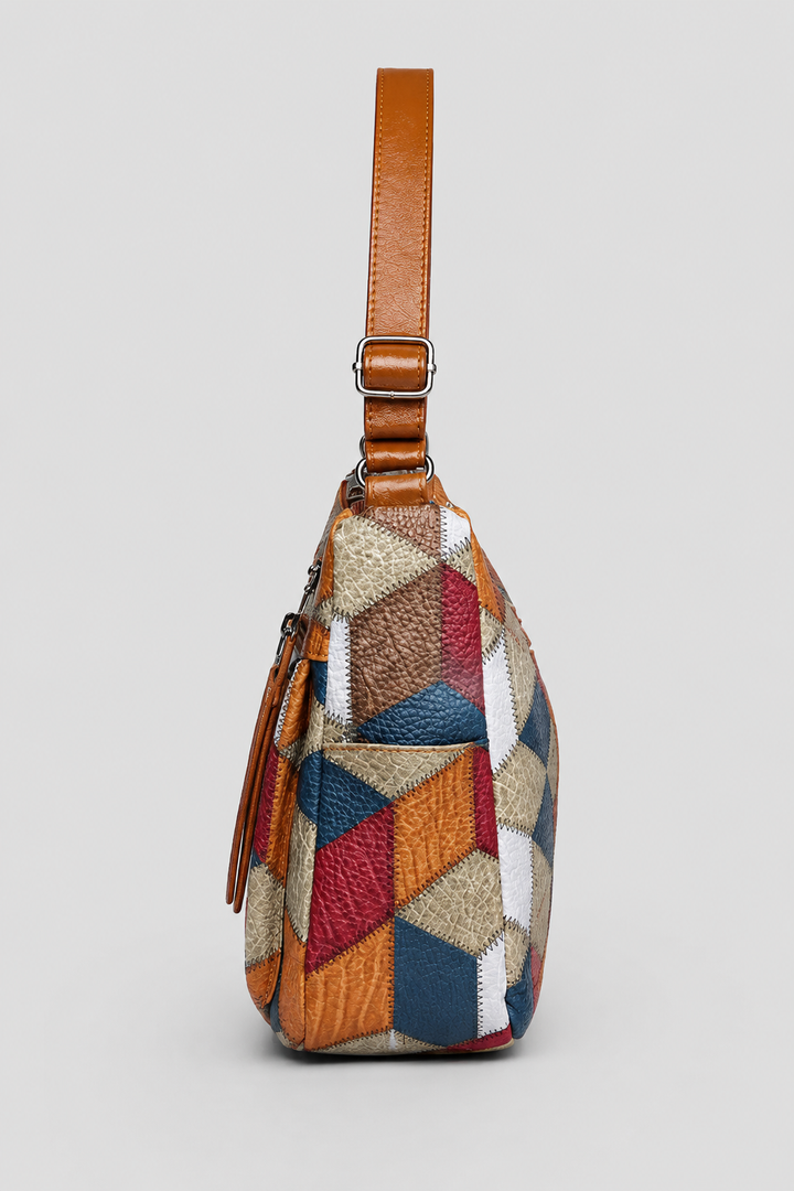 Fashionable women's patchwork shoulder bag with elegant artistic design. Spacious and versatile for daily style.