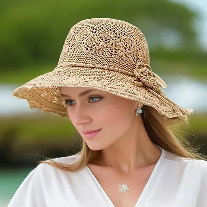 Adjustable elegant women's patterned sun hat with wide brim, a fashionable ladies summer accessory.
