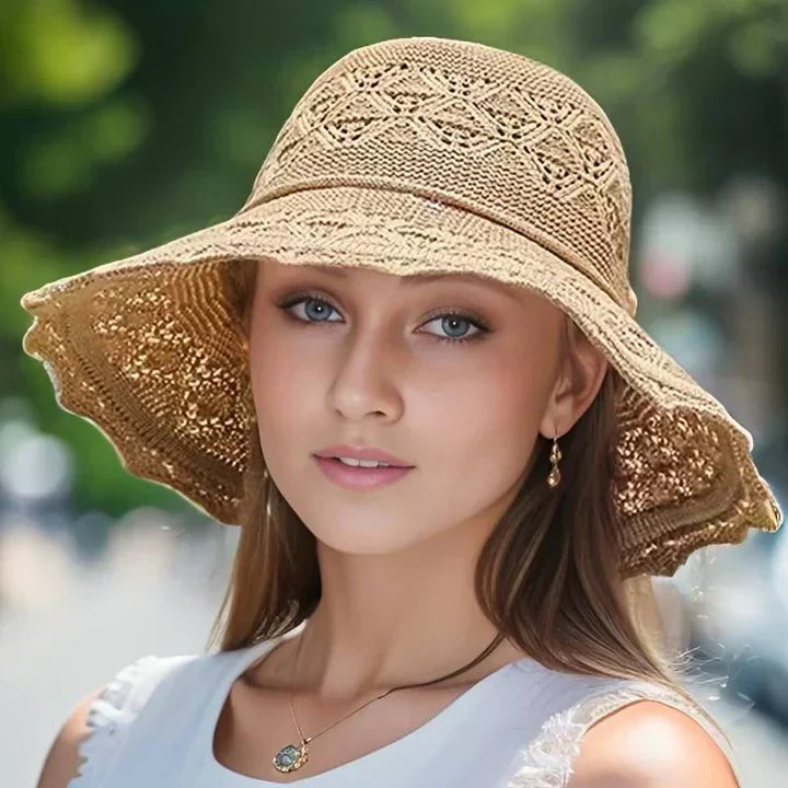 Women's elegant patterned wide brim sun hat, foldable and adjustable, perfect for summer beach travel.