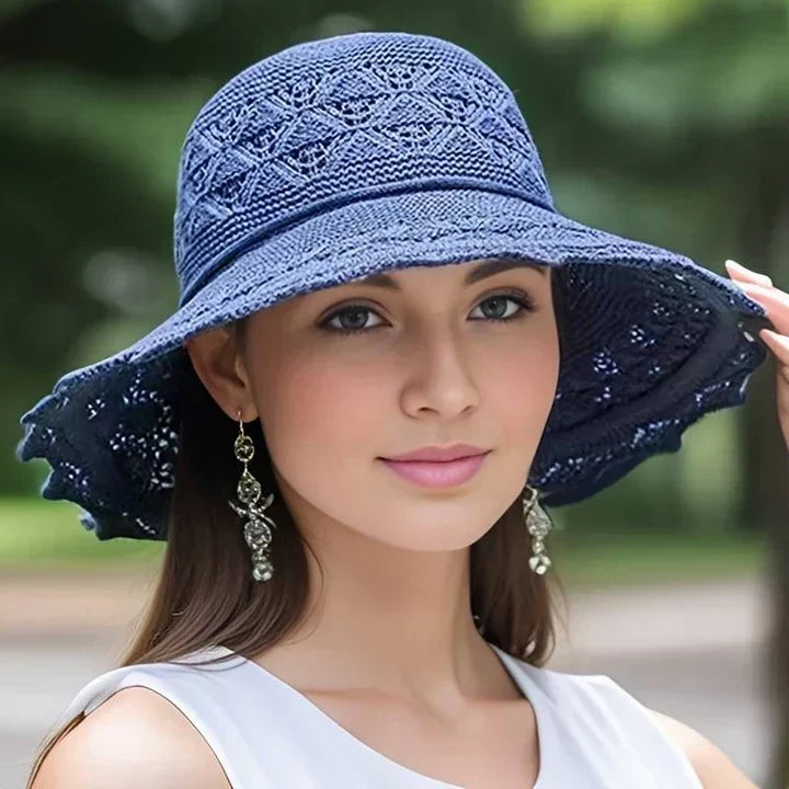 Ladies elegant patterned sun hat with a wide brim, a sophisticated summer accessory for sun protection.