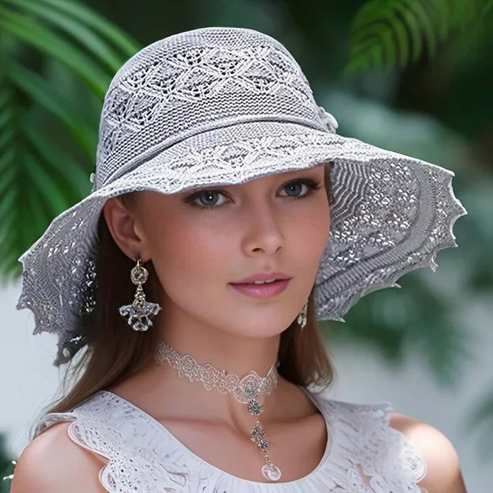 Stylish women's patterned wide brim sun hat, offering excellent sun protection for beach days & summer.