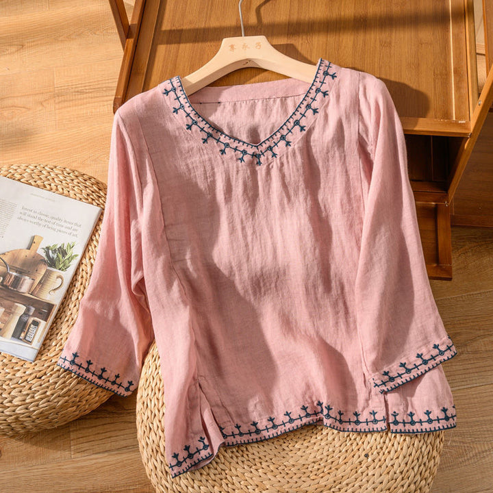 Loose fit women's patterned V-neck short sleeve blouse. Comfortable & stylish casual top for summer and spring.