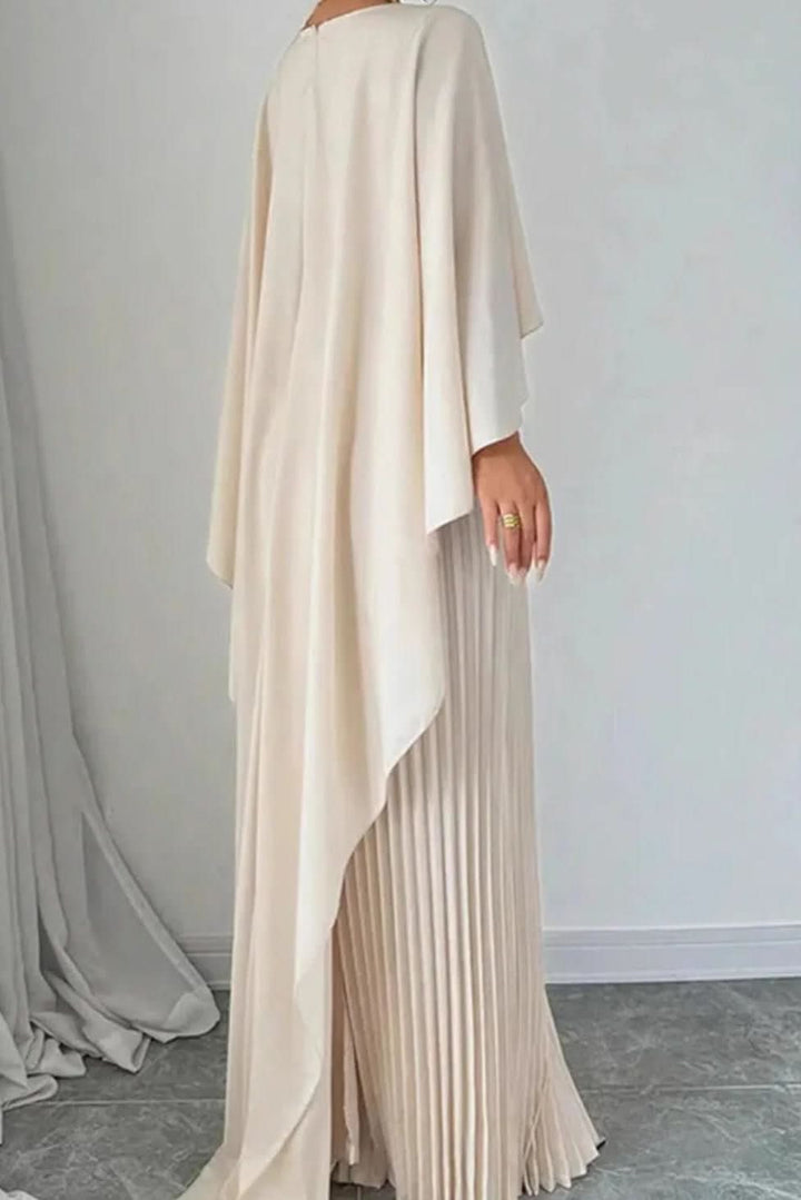 Sophisticated women's long evening gown with a flowing pleated cape design for formal special occasions.