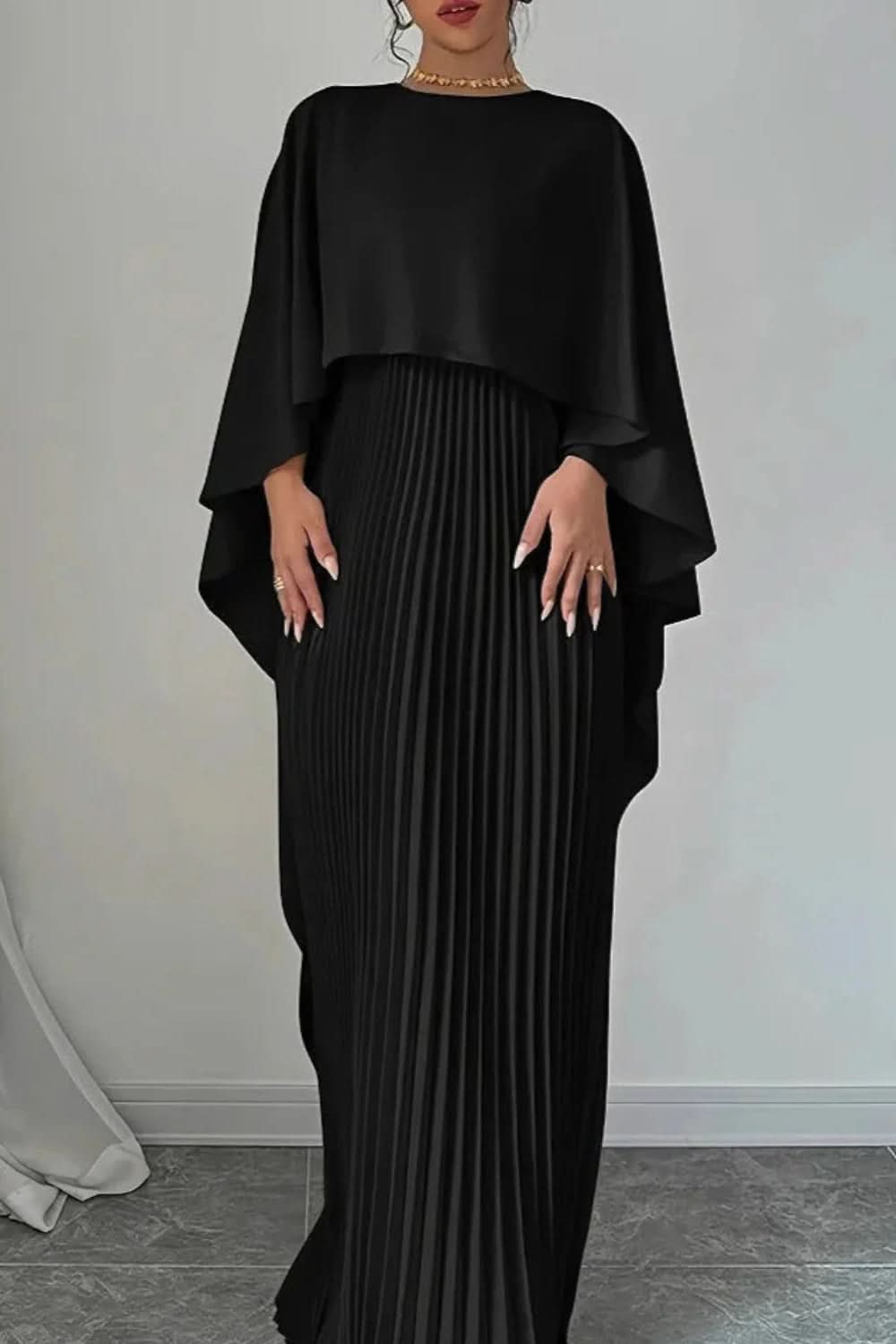 Stunning women's formal cape gown with intricate pleats, a sophisticated choice for elegant evening parties.