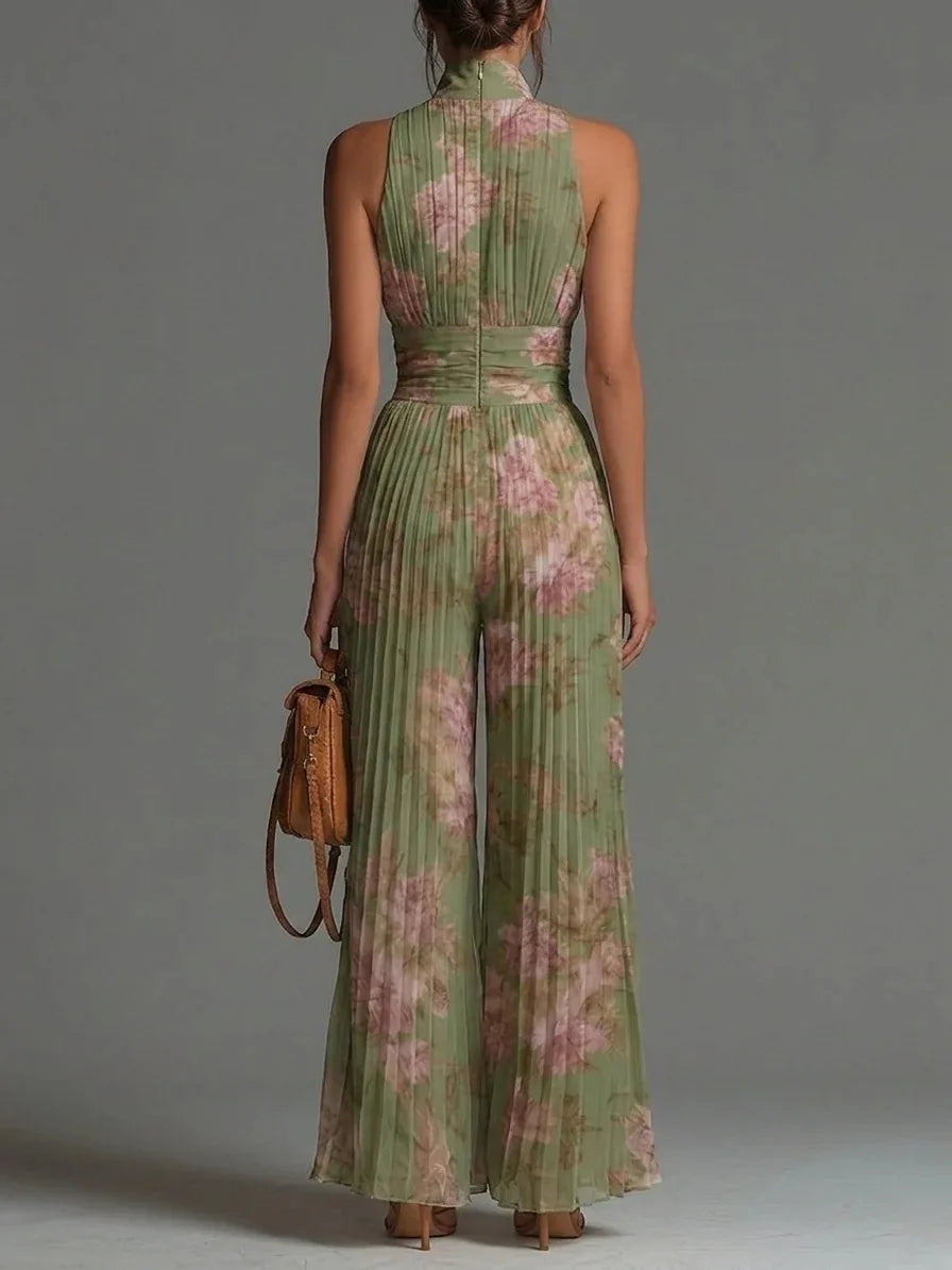 Women's floral print halter jumpsuit with elegant pleats & wide legs, ideal for vacation or party outfits.