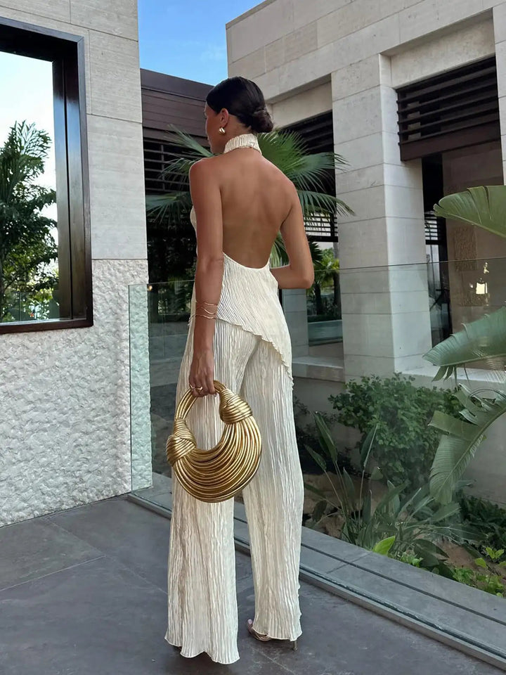 Stylish women's pleated wide-leg set featuring a flattering halter neck, ideal for summer parties and events.