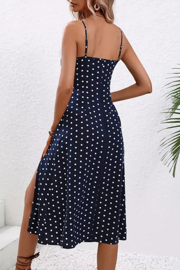 Flowy blue dot pleated halter midi dress for women, ideal for elegant summer occasions.