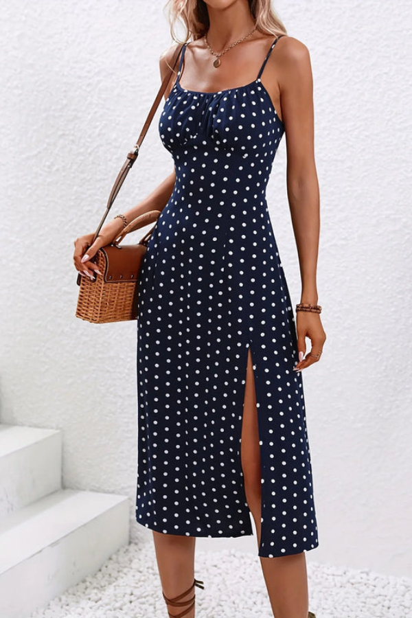 Women's black floral pleated midi dress, stylish halter neck design for parties.
