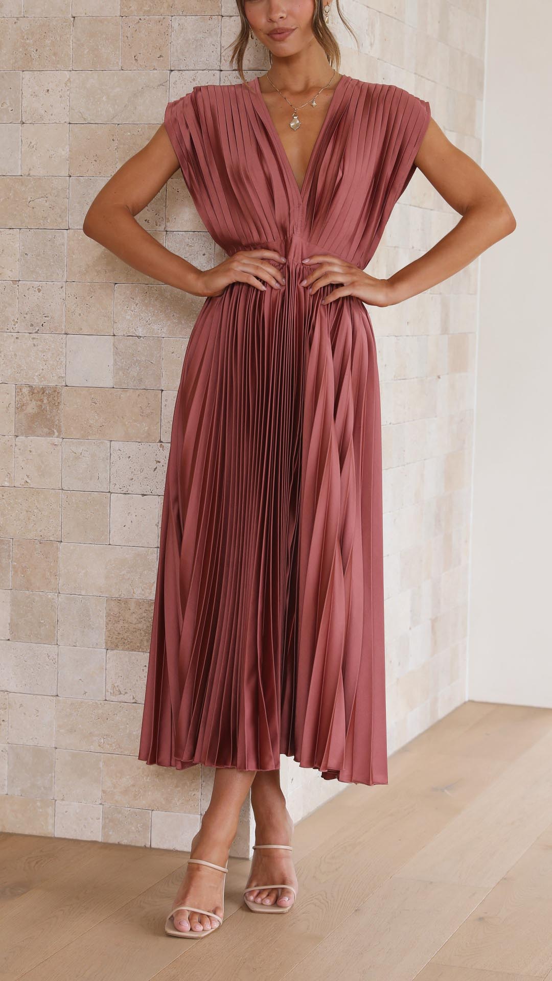 Elegant women's pleated maxi dress with deep V-neck, perfect for wedding guests or evening events.