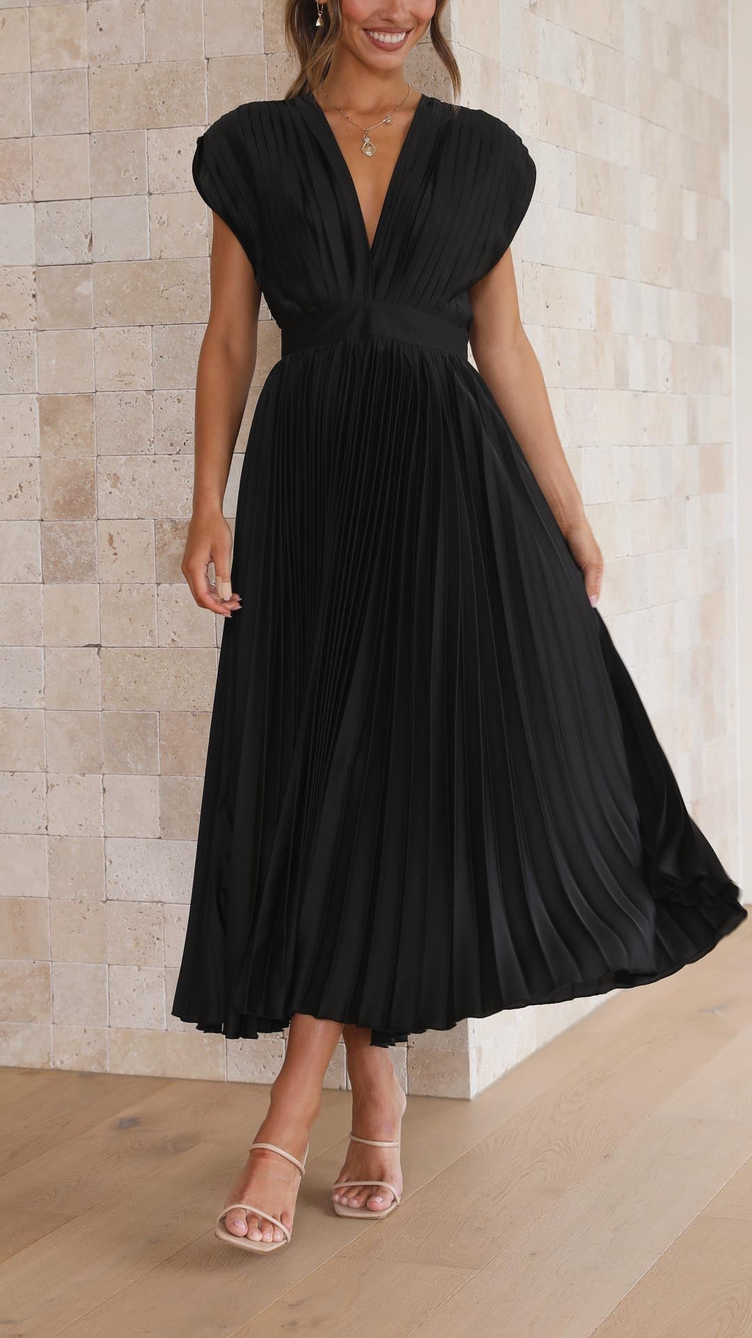 Special occasion pleated maxi dress, women's deep V-neck, sleeveless, elegant party attire.