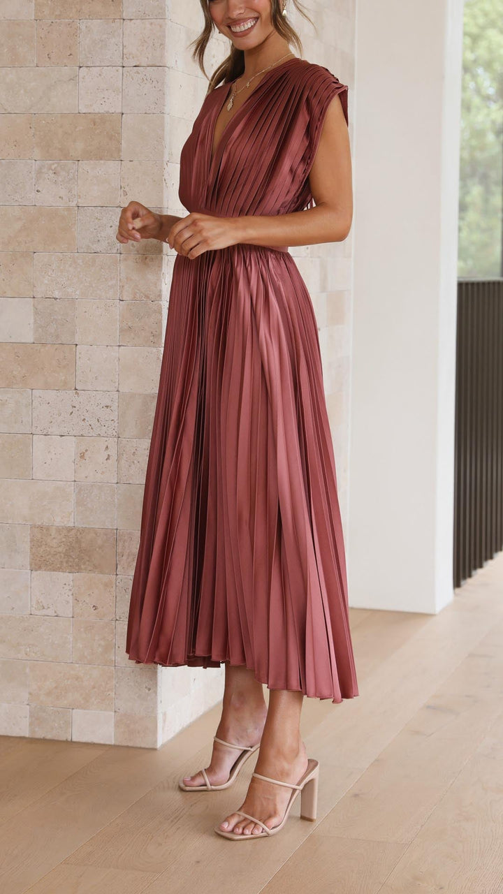Formal women's pleated maxi dress with deep V-neck, perfect for any special occasion.