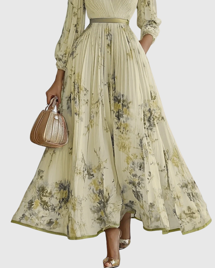 Flowy women's pleated maxi dress with long sleeves & captivating floral print. V-neck for elegant party wear.