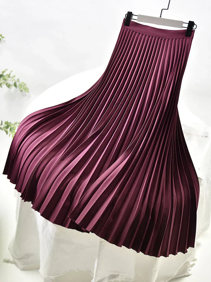 A collection of women's pleated maxi skirts in various colors, essential for spring fashion versatility