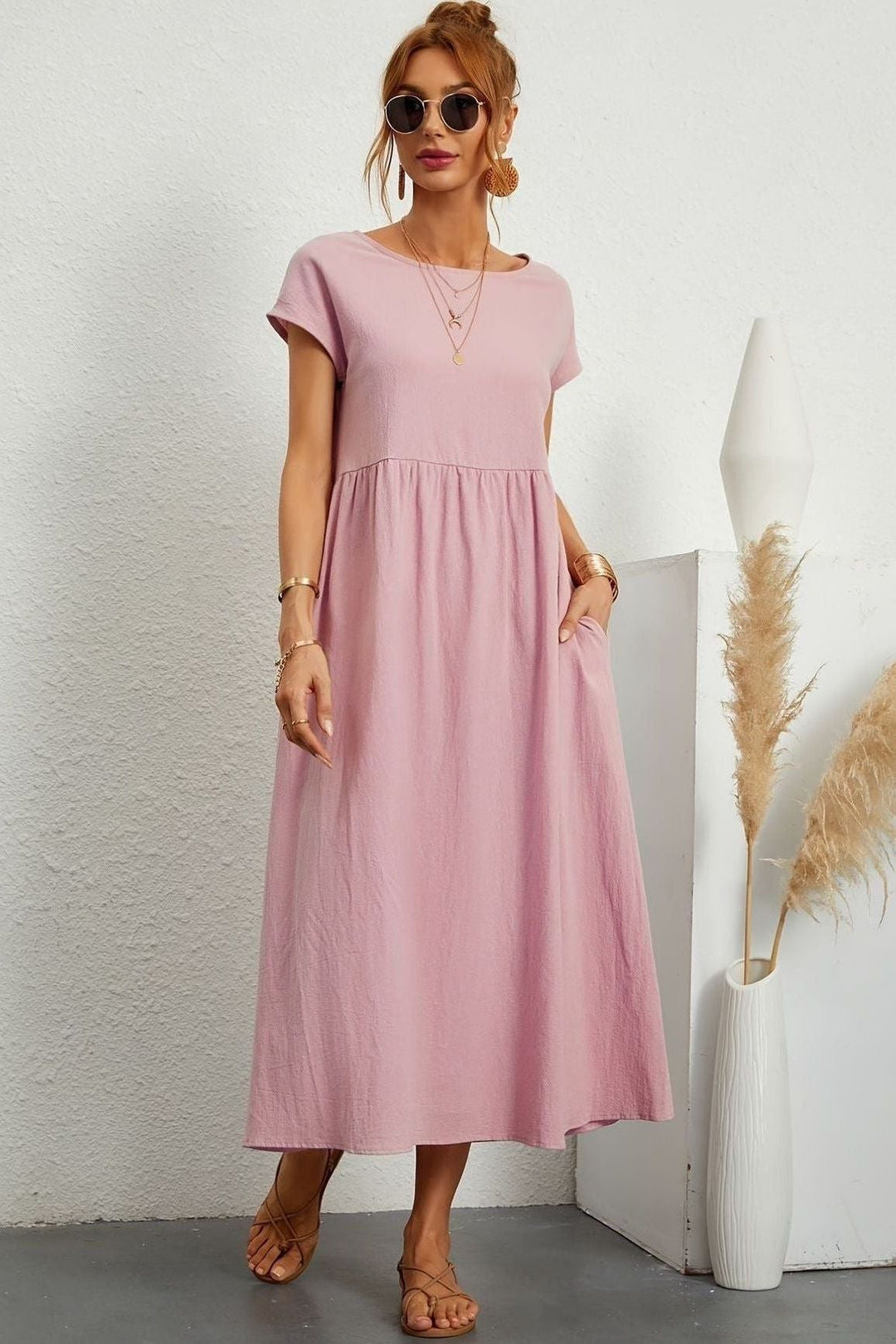 Make a statement with this elegant women's pleated midi dress, perfect for any event. Summer fashion.