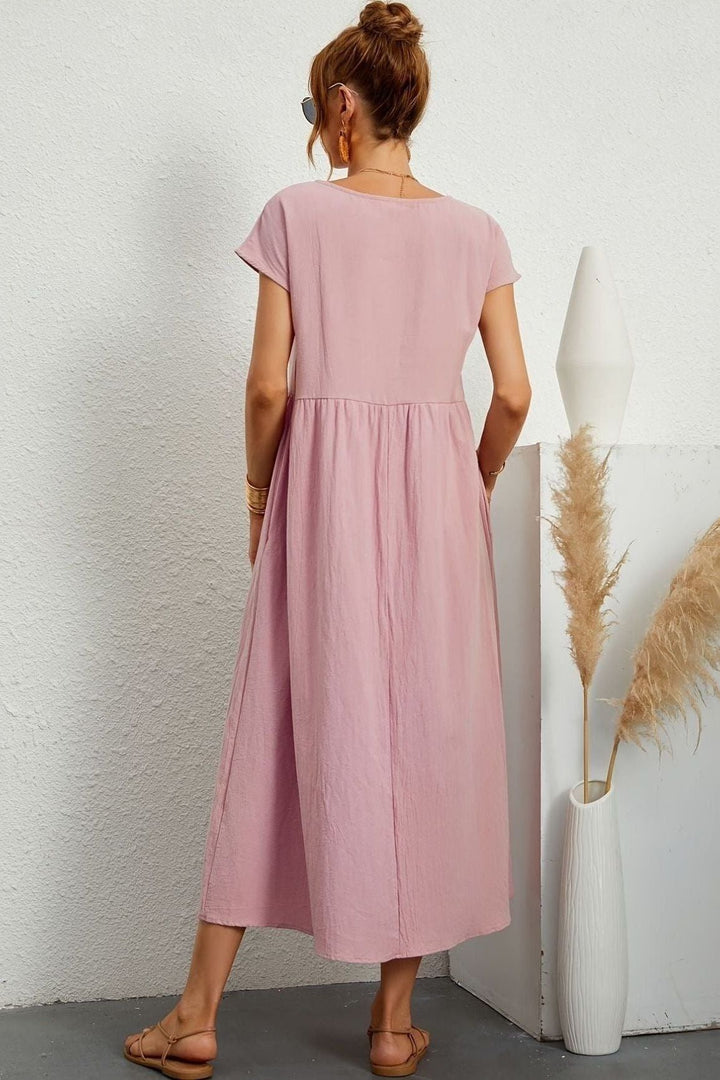 Effortless style in a women's elegant pleated midi dress, great for spring/summer comfort & fashion.
