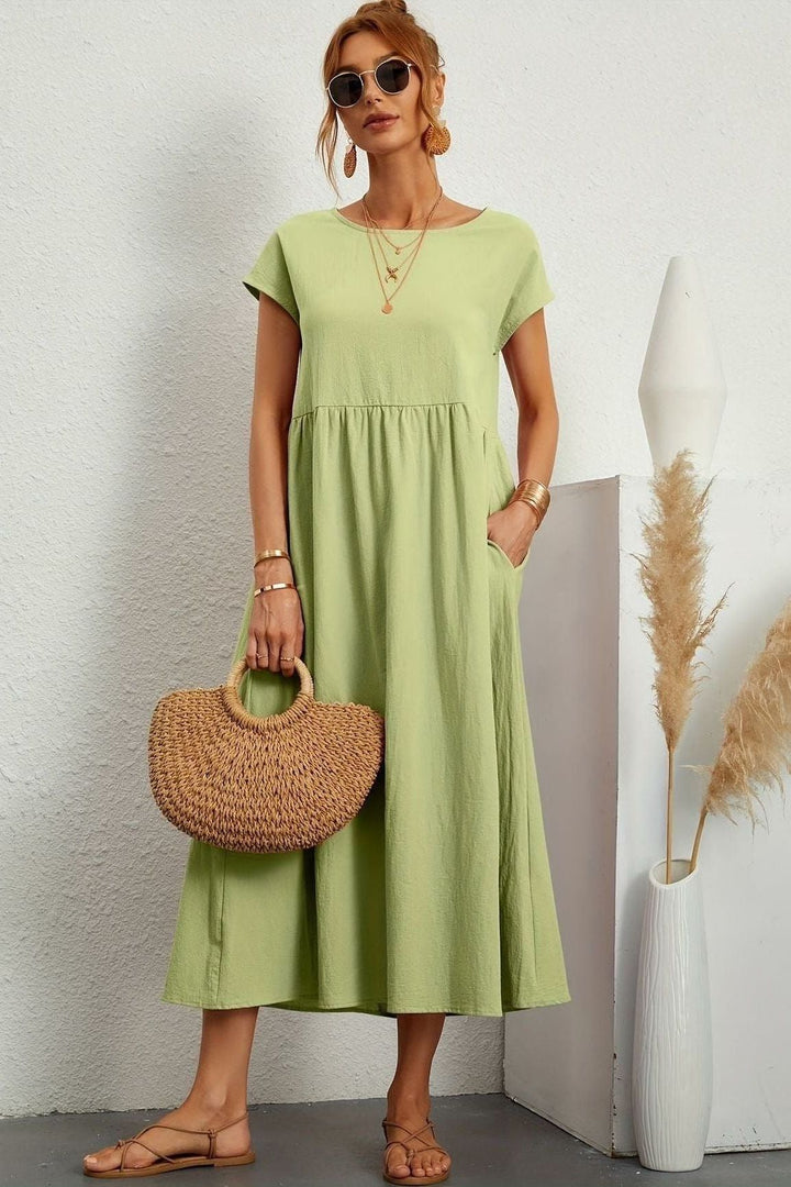 Classic women's pleated midi dress, an elegant & timeless addition to your wardrobe. Relaxed fit.