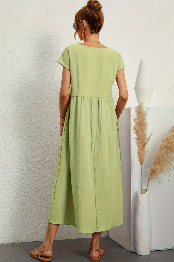 Professional yet stylish women's pleated midi dress, suitable for office attire & elegant everyday.