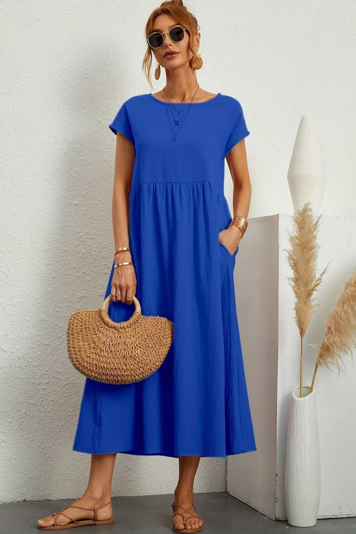 Flattering silhouette of a women's elegant pleated midi dress, enhancing every figure with ease.