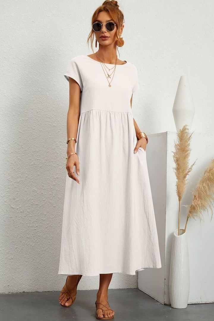 Perfect for seasonal transition, this women's pleated midi dress offers elegant & comfortable style.