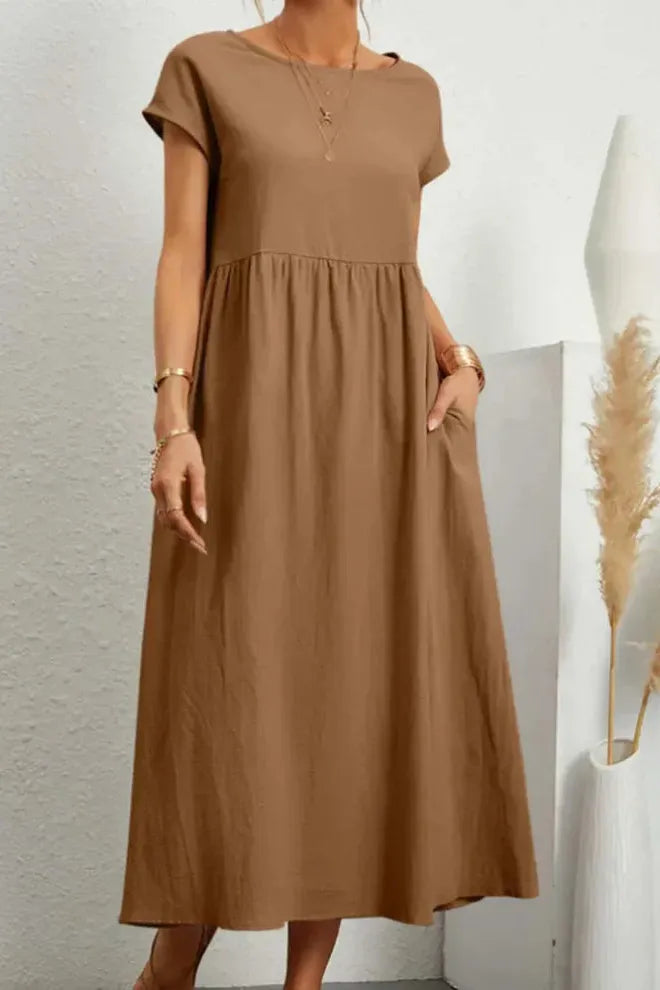 Stylish everyday women's pleated midi dress. Comfortable, knee-length, perfect for spring/summer.