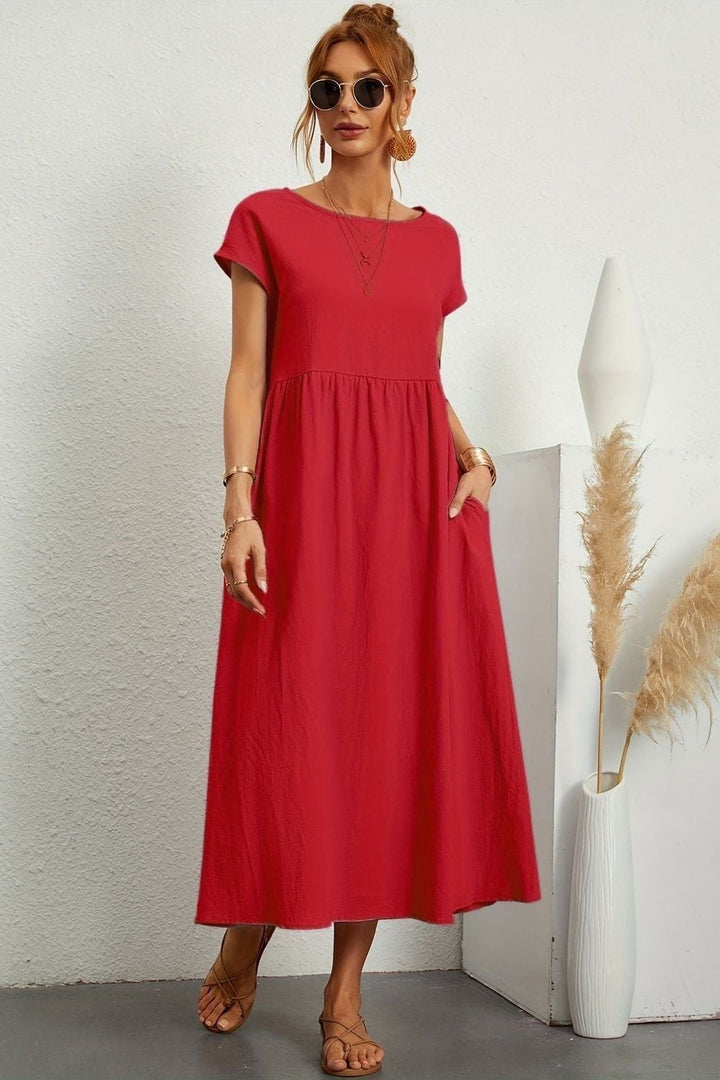 Flowy women's pleated midi dress, perfect for summer & spring fashion. Effortless elegant appeal.