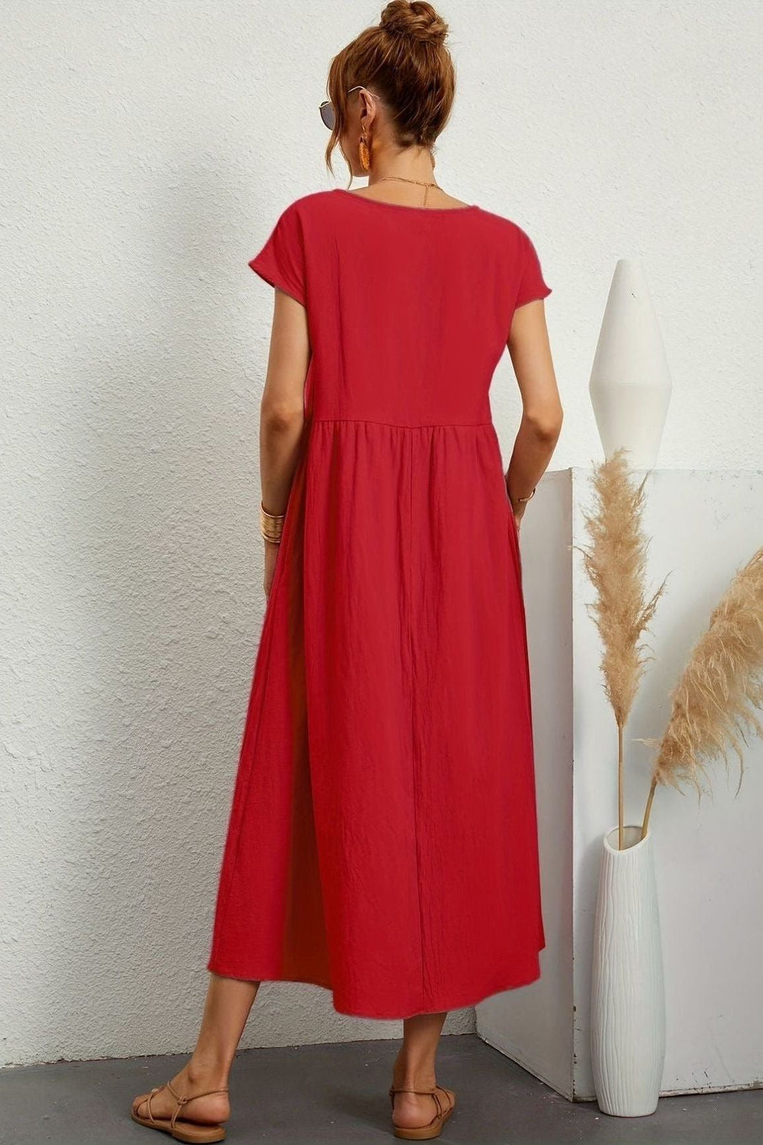 Knee-length elegant pleated midi dress for women, a versatile wardrobe staple for day or night.