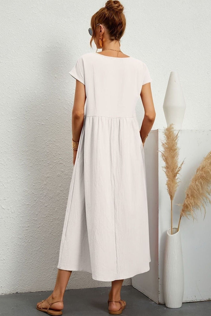 Soft fabric women's pleated midi dress, elegant & comfortable for any occasion. Chic relaxed fit.