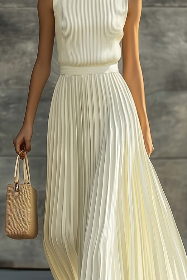 Flowing sleeveless midi dress for women, featuring elegant pleats. Ideal for summer and versatile occasions.