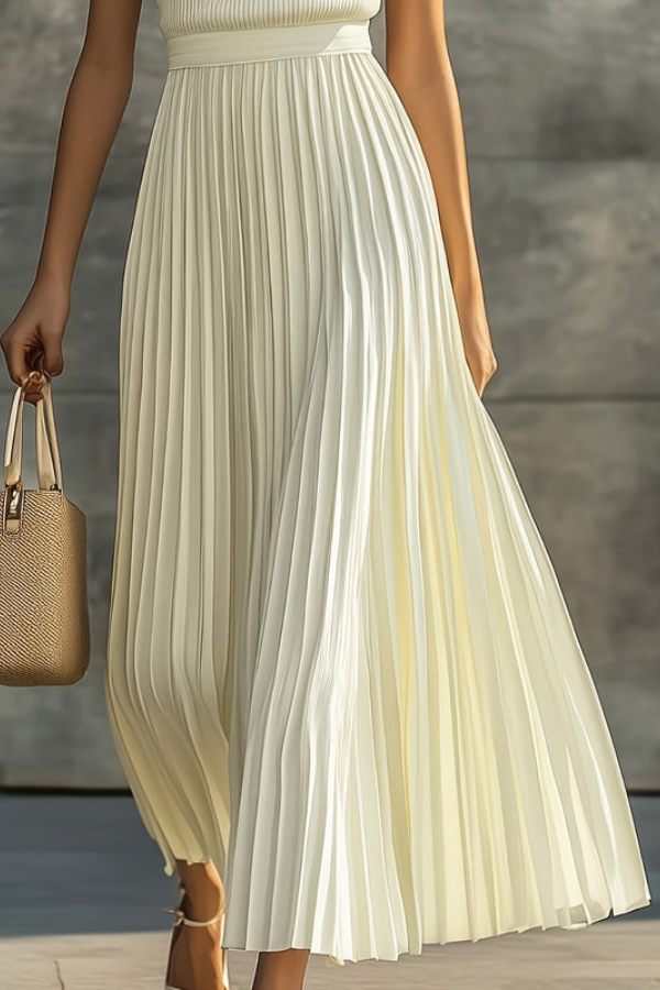 Stylish women's sleeveless midi dress, featuring an elegant pleated skirt for a chic, flowy look.