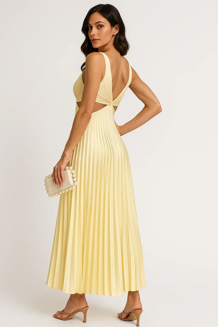 Full shot of a woman in a flowing pleated midi dress, showcasing its elegant design for parties and occasions.