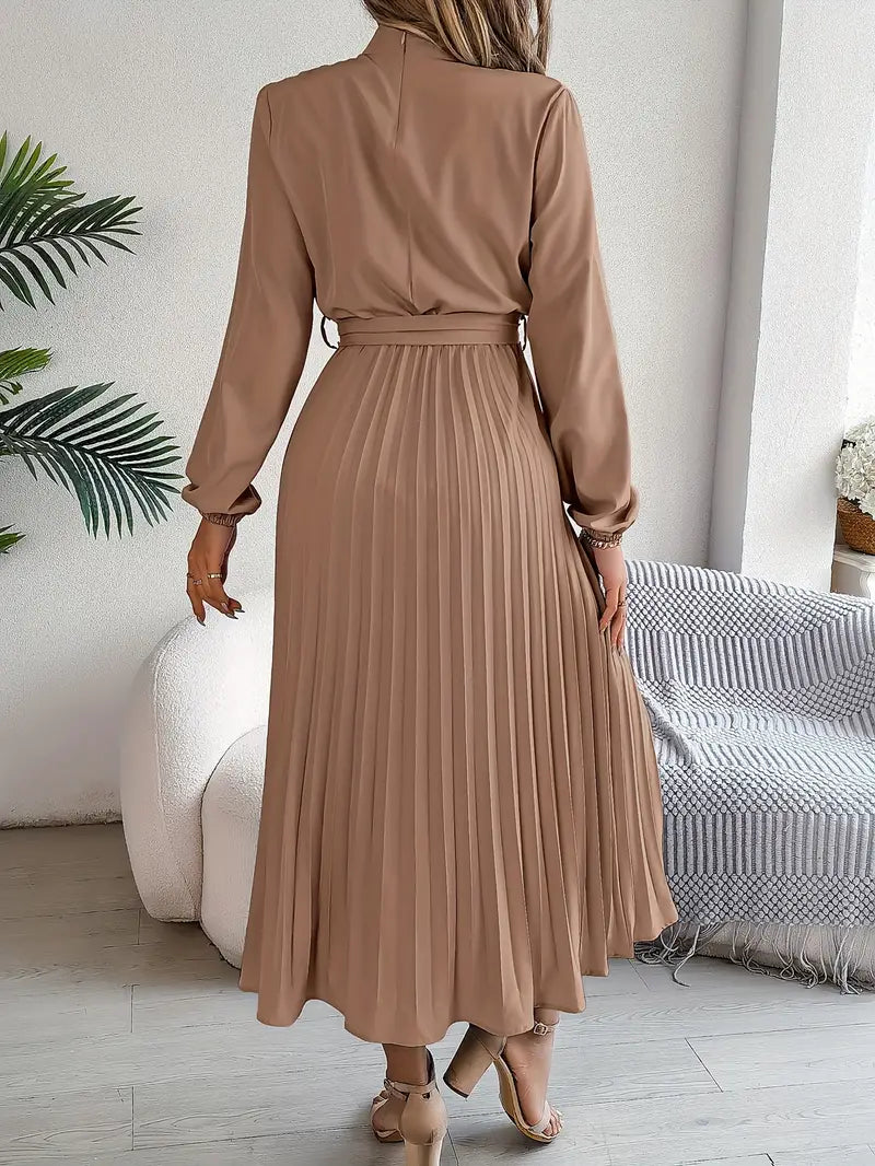 Sophisticated women's pleated midi dress. Long-sleeved design with a flattering belt. Ideal for spring events.