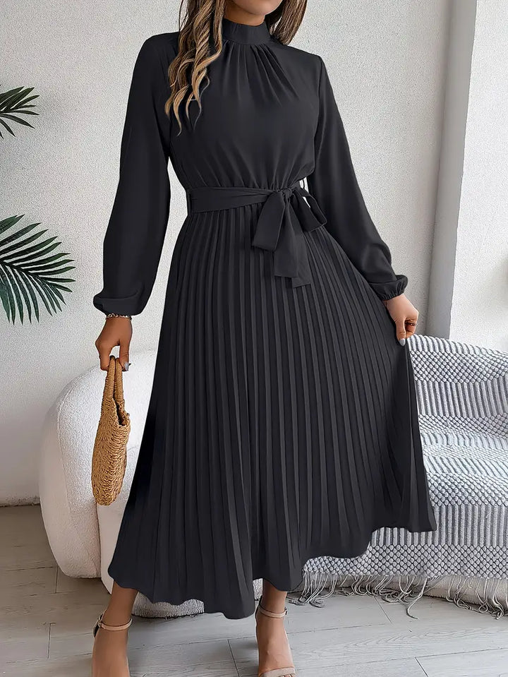 Women's elegant long-sleeve midi dress. Features beautiful pleats and a stylish belt for a complete look.