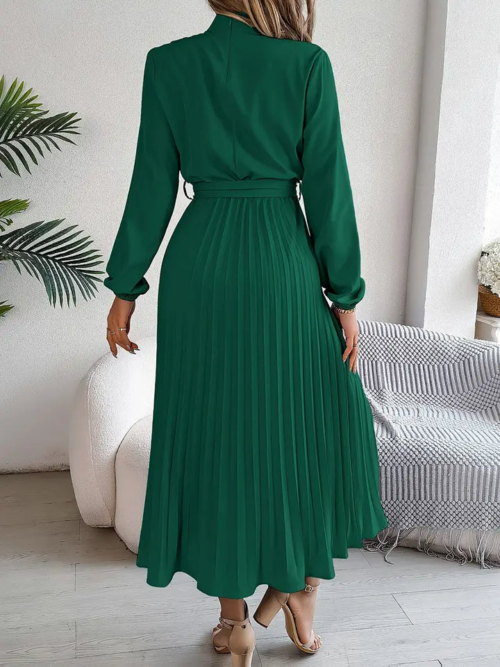 Beautiful women's pleated midi dress, long-sleeved, with a waist-cinching belt. Great for spring casual wear.