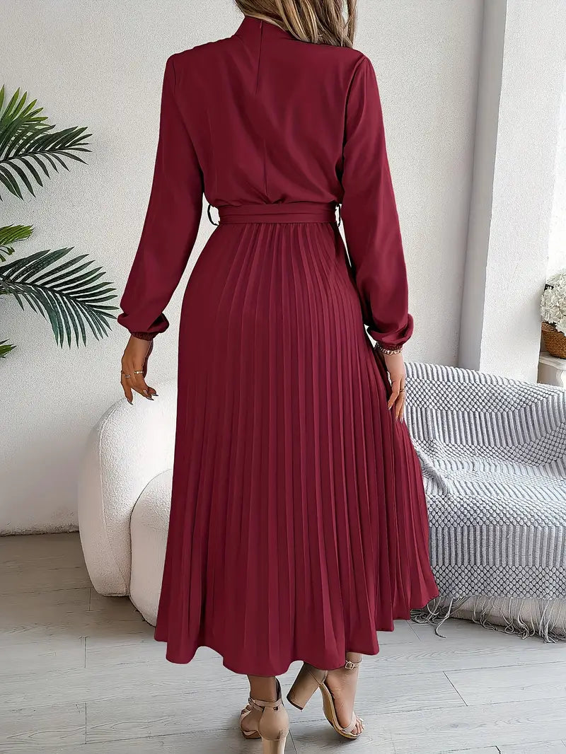 Stylish women's long-sleeve midi dress featuring graceful pleats and a sophisticated belt detail.