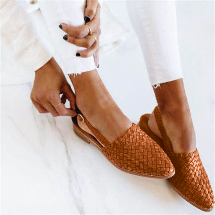 Sophisticated women's flat mules with a pointed toe, providing easy slip-on style and elegant appeal.