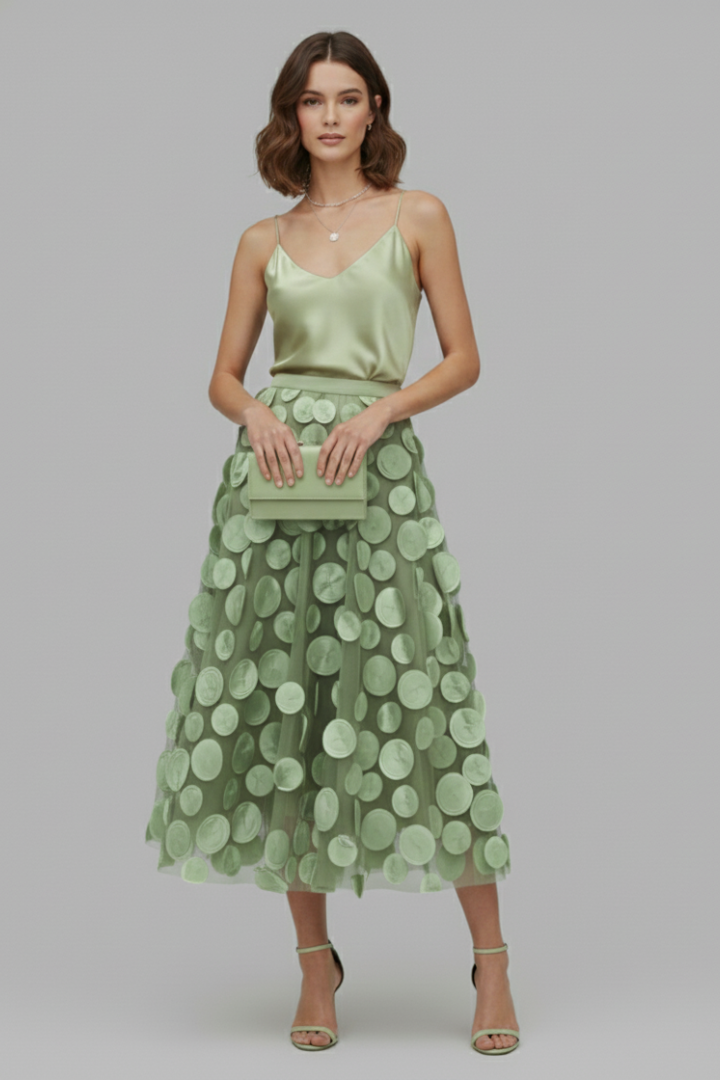 Flowy, elegant women's high-waist polka dot full midi skirt, perfect for versatile styling.