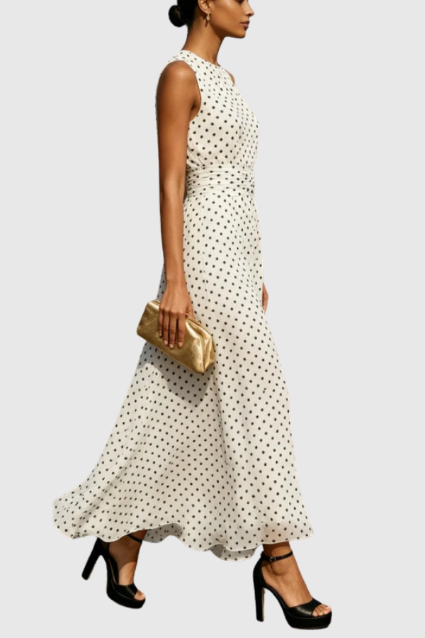 Women's elegant keyhole halter maxi dress in a charming polka dot print with a flowing ruffle hem.