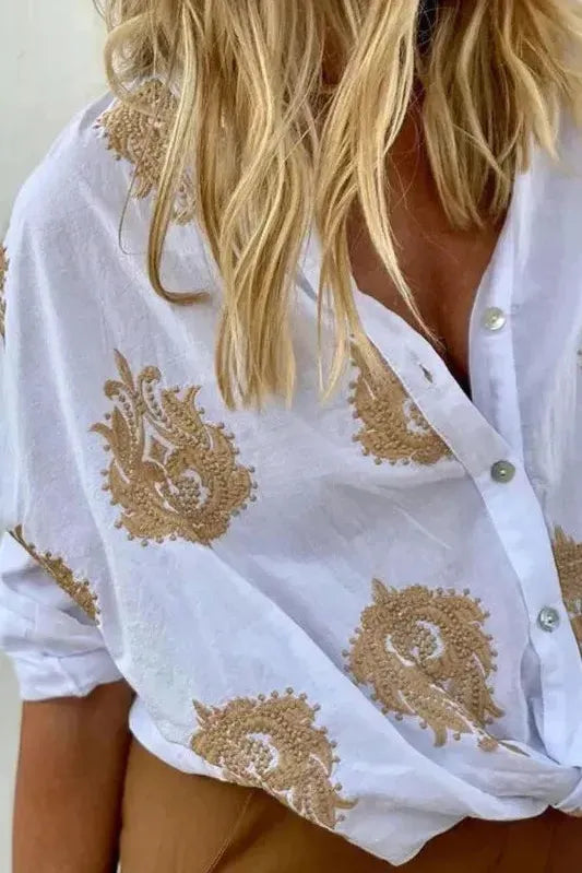 Fashionable women's printed blouse with long sleeves, offering an elegant & versatile top for any occasion.