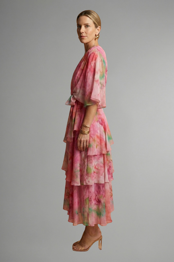 Stylish women's printed maxi dress with a V-neck and long sleeves, ideal for casual or elegant wear.