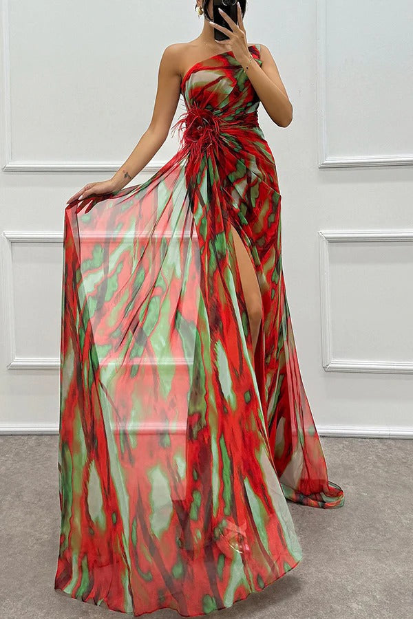 Close-up of the elegant feather detail on a printed maxi wedding guest dress, highlighting its unique design.