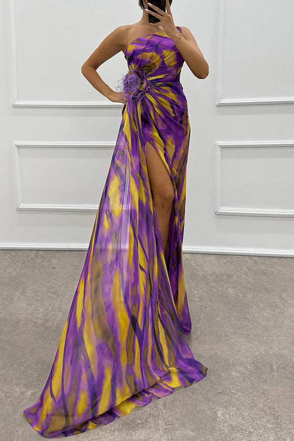 Beautiful patterned evening gown with one-shoulder and stunning feather detail. Perfect for prom or special events.