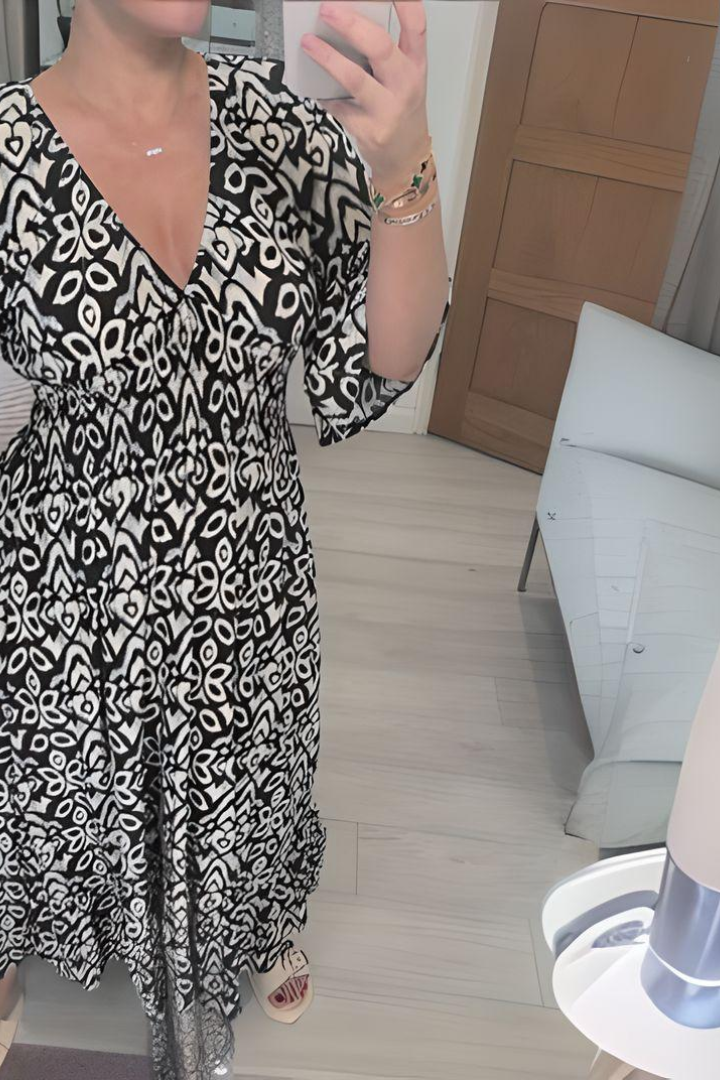 Beautiful spring midi dress for women, featuring a vibrant print and a stylish belted waist. Occasion-ready.