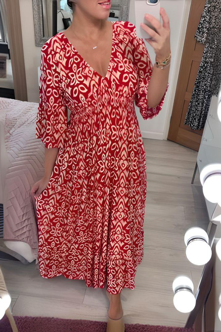 Women's flattering printed midi dress with an elegant design & belted waist, ideal for spring collection.