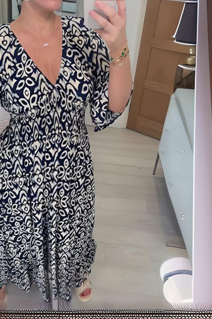 Stylish women's spring midi dress with a unique print and a cinching belted waist for an elegant look.