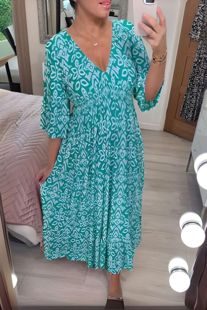 Elegant women's printed midi dress with a flattering silhouette and an adjustable belted waist for spring.